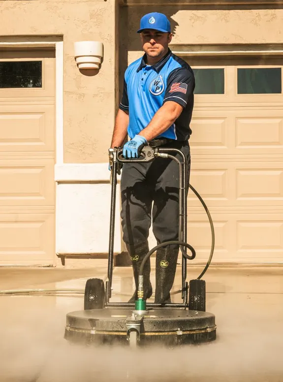 Wash Patrolman Steam Cleaning Concrete Driveway in West Valley City
